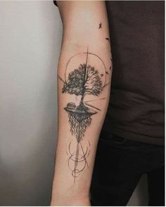 a man with a tree tattoo on his arm