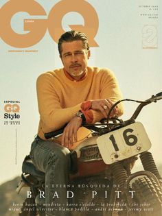 a man sitting on top of a dirt bike in front of a magazine cover that reads go