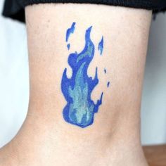 a woman's foot with blue ink on the side of her body and feet