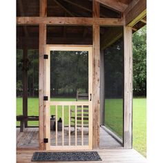 a wooden porch with an open door on it