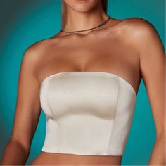 Super Cute Ivory Top That Makes Your Figure Look So Nice Elegant Seamless Crop Top, Elegant Beige Strapless Tube Top, Elegant Cream Crop Top, Elegant Beige Bandeau Top, White Bandeau Top For Night Out, Elegant Strapless Seamless Top, Elegant White Bandeau Tube Top, Fitted Cream Tube Top For Summer, White Bandeau Top With Built-in Bra