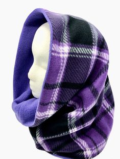 "Stay warm this Fall and Winter in a practical neck and headwear clothing accessory. This two layer super warm reversible hooded scarf will stay on to provide comfort and warmth against cold winter chills. Striking Purple, Black and White tartan pattern is paired with solid Lavender plush fleece on the reverse side to give you options for styling your look. You want the tartan or plain look? This scarf is reversible so you decide! For added styling options wear as a hood scarf with the top folde Free Pattern For Hood With Scarf, Cheap Hooded Tops For Outdoor Activities, Fleece Scarf Sew, Free Hooded Scarf Pattern, Triangle Scarf Sewing Pattern, Winter Camping Outfits, Reversible Plush, Hood Scarf, Hoodie Scarf