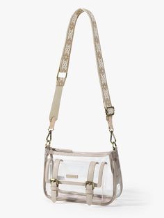 Elevate your event style with our Lila's Clear Crossbody Bag. This chic accessory complies with the clear bag policy. You can pass through security checks quickly and easily at any sporting events, concerts, festivals or any other outdoor activities. Made of premium PVC and vegan leather Gold-colored hardware, waterproof and durable, easy to clean. A transparent and spacious interior makes it easier to access your essentials An adjustable embroidery-patterned strap can be used as a shoulder bag Everyday Rectangular Shoulder Bag With Transparent Straps, Clear Satchel With Clear Strap For Everyday Use, Daily Use Satchel With Clear Strap, Large Capacity Clear Travel Satchel, Everyday Satchel With Clear Crossbody Strap, Everyday Satchel With Clear Strap And Crossbody Shape, Travel Satchel With Clear Strap, Casual Rectangular Bag With Transparent Straps, Clear Bag With Clear Strap For Spring