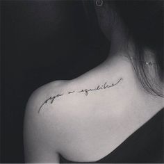 a woman's upper back shoulder tattoo with the words love and happiness written in cursive font