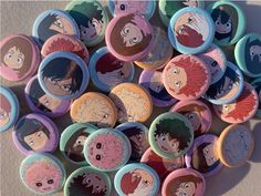 many buttons with anime characters on them