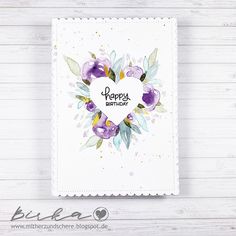 a card with watercolor flowers and the words happy birthday