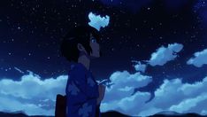 a person standing in front of some clouds and the sky is filled with bright stars