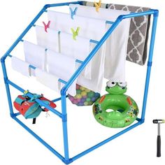 a blue rack with towels and toys in it