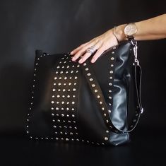 Large leather crossbody bag with studded flap and adjustable strap for chic women. Large messenger bag with studs practical and comfortable with a lot of capacity because it has a wide bottom, has an inside pocket and a strap with a small carabiner for keys or a small purse, the bag closes with magnet. It has an adjustable strap with studs on both sides, you can use it for other bags because you will fall in love with it. This great bag can be carried over the shoulder or as a shoulder bag. The strap which is also made with studs is adjustable on both sides, it covers different styles, urban, casual, gothic, punk, you can wear it with jeans and sneakers or with a suit jacket and heels is a very versatile collection.  I work all the models little by little and in order of order, with profes Riveted Satchel Shoulder Bag, Chic Crossbody Shoulder Bag With Rivets, Studded Shoulder Bag For Everyday Use, Crossbody Style, Chic Rivets Crossbody Shoulder Bag, Everyday Shoulder Bag With Rivets, Everyday Studded Bags, Studded Crossbody Bags For Everyday Use, Everyday Crossbody Bags With Studs, Travel Crossbody Bag With Rivets