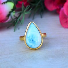 Gold Larimar Ring, Natural Dominican Larimar Gemstone Ring, 14K Yellow Gold Ring, Bezel Pear Larimar Ring, Wedding Gift Gold Ring Jewelry Gemstone : Dominican Larimar Ring Size : Select Your Size Gemstone Shape : Pear Gemstone Dimension Approx : 18 x 11 mm Larimar is not only a rare and beautiful stone reminiscent of the clear blue waters that surround the area that it comes from in the Caribbean, but it is said to be a stone that promotes feelings of serenity and works on the throat chakra, ope Larimar Turquoise Gemstone Ring For Anniversary, Larimar Ring, Wedding Larimar Gemstone Rings, Elegant Larimar Jewelry, Elegant Blue Larimar Rings, Luxury Blue Larimar Ring, Adjustable Blue Larimar Ring, Larimar Rings, Gold Rings Jewelry