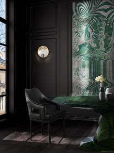 an elegant dining room with green and white wallpaper