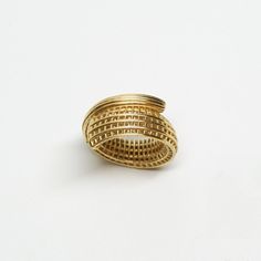 Fine JewelryITEM DESCRIPTION: Spiral Ring 14k Gold This unique ring made with a 3D printing technique made of 14k solid gold. Design with net texture. The manufacturing process results in a hollow object shaped like a spiral strip. Its flat sides make it smooth and comfortable to wear. IN STOCK Finger Size: US Size 5 / European size 50 - DETAILS - Metal: 14k yellow solid gold Band Width: approx. 5 mm - 13 mm Band Thickness: approx. 4 mm - SHIPPING - Packed in an elegant labeled gift box and read Modern Yellow Gold Spiral Ring, Modern Spiral Yellow Gold Ring, Modern Gold Spiral Ring, Sculptural Ring, Modern Cocktail, Unusual Rings, Spiral Ring, Unique Bands, Solid Gold Band