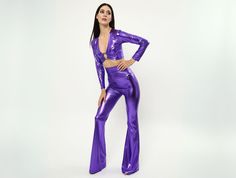 Purple butterfly style blouse and trouser suit is everyone's favorite with its metallic fabric and cute style. The metallic long-sleeved blouse has a ring detail in the middle. This set, which is prepared together with bell pants, has a highly flexible fabric. He never restricts you. A unique choice for all crazy parties, festivals, stage, show and dance performances. We can prepare it for you in many different colors and fabrics. Just leave a note in the personalization pane. The inner seam len Purple Sets For Fall Party, Fitted Long Sleeve Pant Set For Party, Purple Stretch Party Sets, Stretch Long Sleeve Pant Set For Party, Spring Party Pant Set With Long Sleeves, Long Sleeve Pant Set For Spring Party, Spring Party Full-length Sets, Fitted Pant Set For Fall Party, Stretch Pant Set For Spring Party