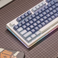 a computer keyboard sitting on top of a table