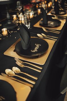 black and gold table setting with place settings