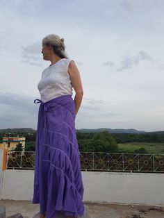 "Unique Skirt / Long Flowy Skirt / Bocho Skirt / Long Skirt / Linen Skirt / Violet Skirt / Womens Long Skirt / Womens Skirt / Skirt This long flow skirt is high quality handmade linen clothing. The length of linen skirt can be different. It is gentle, accurate and high quality work. Handmade from linen fabric. All linen clothes for women and man made to order special for You and Your dimensions. Plus size clothing is available. The wholesomeness of the landscape and the vast expanse of nature th Purple Asymmetrical Skirt For Summer, Purple Gathered Skirt Bottoms, Purple Tiered Skirt For The Beach, Purple Tiered Skirt For Beach, Cotton Long Wrap Skirt, Purple Beach Skirt, Long Purple Cotton Skirt, Long Ruffled Skirt In Purple, Purple Cotton Tiered Skirt