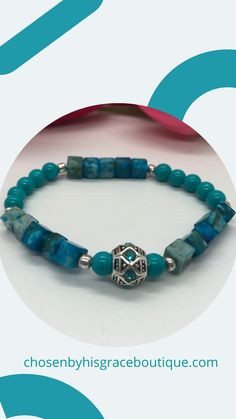 This is a beautiful beaded bracelet is made with a Tibetan silver focal bead with aqua rhinestones. There are Imperial Jasper cube beads, Aqua glass round beads and silver spacer beads. Tibetan silver focal bead is .5"Imperial Jasper cube beads are 6mm.Aqua glass round beads are 6mm. Silver spacer beads are 4mm. Thank you for visiting Chosen By His Grace Boutique! Gift Rondelle Stretch Bracelet With Spacer Beads, Elegant Turquoise Stretch Bracelet With Spacer Beads, Elegant Turquoise Beaded Bracelets With Silver Beads, Elegant Turquoise Beaded Bracelet With Silver Beads, Turquoise Beaded Stretch Bracelet With Round Beads, Turquoise Stretch Bracelet With Silver Beads, Elegant Turquoise Crystal Bracelet With Spacer Beads, Adjustable Turquoise Stretch Bracelet With Silver Beads, Adjustable Turquoise Crystal Bracelet With Silver Beads