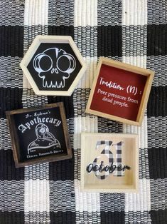 three different types of rubber stamps sitting on a checkered tablecloth with black and white designs