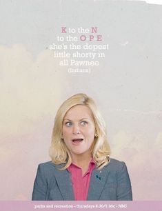 a woman with blonde hair wearing a suit and pink shirt is looking up at the sky