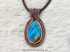 "Sleek Labradorite Pendant Necklace created with Wire Wrapping. Copper Crystal Wire Wrapped Pendant, Protection Necklace Witchy Jewelry Unique Handmade Artisan Jewelry !! Original Designs by ArtsvilleHandcrafted The pendant is made from pure copper wires and Labradorite stone combination.. Wear this necklace for the healing properties of this amazing stone. Select Necklace Length of your choice !! All Jewelry is nicely packed and dispatched within 1-2 working Days. I love to create beautiful uni Handmade Labradorite Oval Pendant Necklace, Artisan Handmade Labradorite Necklaces, Handmade Labradorite Oval Pendant Jewelry, Handmade Oval Labradorite Necklace, Handmade Oval Labradorite Jewelry, Handmade Artisan Labradorite Jewelry, Handmade Oval Artisan Jewelry, Handmade Oval Nature-inspired Jewelry, One Of A Kind Labradorite Necklaces For Gifts