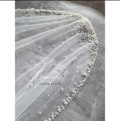 wedding veil with pearls on the bottom