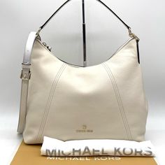 Brand New With Tag Michael Kors Sienna Shoulder Crossbody Bag Color: Light Cream Shoulder Bag Pebbled Leather 100% Leather From Tanneries Meeting The Highest Standards Of Environmental Performance From Tanneries Meeting The Highest Standards Of Environmental Performance Gold-Tone Hardware 13"W X 12.75"H X 4.5"D Handle Drop: 6" Exterior Details: Detachable Crossbody Strap Interior Details: Back Zip Pocket, 6 Slip Pockets Lining: 100% Polyester Zip Fastening Dust Bag Not Included Imported Luxury White Hobo Bag, Designer White Hobo Bag For Daily Use, White Hobo Bag With Double Handle, Designer White Hobo Bag, Luxury White Leather Hobo Bag, Classic White Hobo Bag For Errands, Designer White Hobo Bag For Shopping, Luxury White Hobo Bag With Removable Pouch, Elegant White Crossbody Hobo Bag