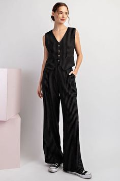 Pinstriped pants featuring a button and zipper closure, belt loops, front pleats for detail, two side hip pockets and is a straight leg design. Styled with our Whitney sleeveless vest. Available in black and navy. Model is 5'9" and is wearing a small. Fit chart in photos Fabric Contents: 92% Polyester, 5% Rayon, 2% Spandex Pin Stripe Vest Outfit, Pinstripe Overalls Outfit, Stripe Vest Outfit, Curvy Girl Dress, Vest And Pants, Overalls Outfit, Striped Vests, Straight Leg Pant, Pinstripe Pants