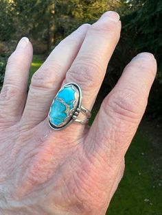 Swimmingly beautiful Sea Sediment Jasper stone that brings to mind Caribbean blue seas!  This stone is so pretty - the blue has hints of white and a lovely gold matrix crosses the center. Set in fine and sterling silver, the stone is framed with a pretty scalloped bezel and a simple shadow box with wire and bead border.   Definitely one of our favorites!  The ring has a nice weight and a very comfortable split shank.  Ring is US Sized 6.75.  The face of the setting is approximately 1/2 inch wide by 1 inch length.   We are a small family business.  All of our jewelry is handmade by us with fine and sterling silver and beautiful stones.  We source the majority of our turquoise cabochons from small business lapidary artists located in the United States. Find us on Instagram: @RimmerCreations Blue Opal Inlay Ring For Anniversary, Blue Opal Ring With Inlay For Anniversary, Anniversary Blue Opal Ring With Inlay, Unique Blue Turquoise Ring With Inlay, Blue Inlay Rings For Anniversary, Blue Oval Rings With Inlay, Blue Turquoise Ring With Inlay, Southwestern Blue Turquoise Ring With Natural Stones, Southwestern Style Blue Turquoise Ring With Natural Stones