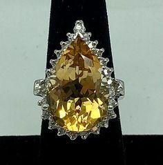 a fancy yellow diamond ring on display