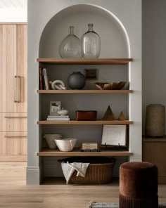 a living room filled with furniture and shelves