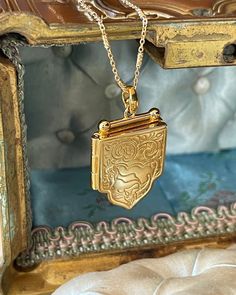 Beautiful Shield Locket Necklace with beautiful details. Gold plated silver locket and chain. Locket measurements 25.7mmx28mmx4mm. Wedding Jewelry Gold, Chain Locket, Gold Shield, Faberge Jewelry, Locket Design, Picture Locket, Latest Jewellery Trends, Silver Locket, Head Jewelry