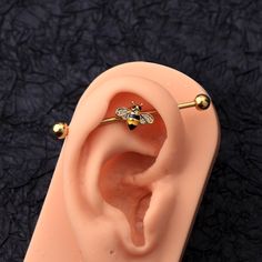 a fake ear with a bee on it