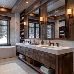 a large bathroom with two sinks and a bathtub in the middle, along with windows