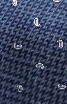 Small, neat patterns bring understated distinction to a tie made of Italian silk and styled to elevate any formal look. 3 1/4" width; 58" length 100% silk Dry clean Made in the USA of imported fabric Blue Silk Suit And Tie Accessories For Office, Elegant Blue Fabric For Formal Occasions, Elegant Blue Formal Fabric, Patterned Silk Suit And Tie Accessories For Business, Patterned Silk Ties For Business, Silk Patterned Ties For Black Tie Events, Blue Silk Ties For Semi-formal Occasions, Silk Suit And Tie Accessories For Semi-formal Occasions, Fitted Elegant Business Fabric