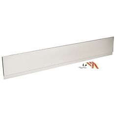 a white wall mounted shelf with two screws and some tape on the bottom half