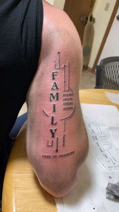 a man's leg with the word family on it