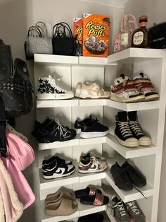 a white shelf filled with lots of shoes and handbags on top of it's shelves