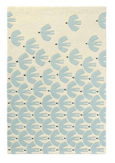 a blue and white rug with fish on it