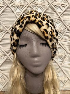 Brand new take on one of my favorite prints! This super soft cheetah style turban is NEW ready to hug your head! If you love this print make sure to check out the Zebra Chic Turban! *One size turban fits all *Turban can be worn 3 different ways (band in front/band to the side/band at the back) *Requires NO wrapping *Super soft and stretchy poly spandex blend fabric *Machine wash cold. Hang/lay flat to dry. No bleach or fabric softeners. DK Design Headwear designs Turbans, TurBANDS, and other hai Adjustable Brown Bohemian Turban, Casual Adjustable Leopard Print Hat, Cheetah Style, Leopard Print Beanie, Leopard Headband, Leopard Print Fur Hat, Fearless Women, Bad Hair Day, Hug You