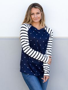 Looking for a stylish and comfortable top to wear this fall and winter? Look no further than our Polka Dot Stripe Raglan Top in classic black! Made from super soft and cozy fabric, this top is perfect for running errands or dressing up with a cute skirt for a night out. The raglan style adds a touch of sporty chic to any outfit, while the polka dot and stripe pattern gives it a fun and playful twist. Size: Small 0-4 Medium 6-8 Large 10-12 XL 12-14 Custom Coffee Mugs, Raglan Top, Maxi Skirt Dress, Cute Skirt, Fall Winter Wardrobe, Comfortable Tops, Custom Coffee, Sporty Chic, Cute Skirts