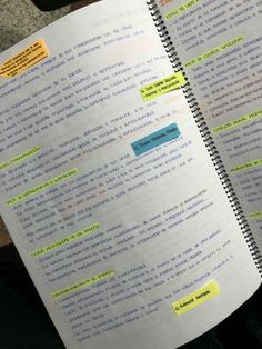 an open notebook with sticky notes attached to it