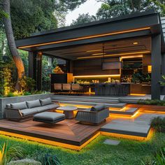 an outdoor living area with couches and lights