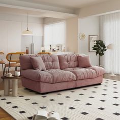 a living room filled with furniture and a white rug