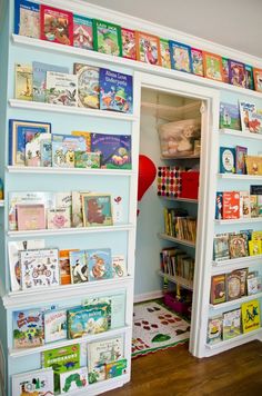 the children's bookshelf is full of colorful books