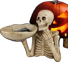 a skeleton holding a tray with a halloween pumpkin in the background