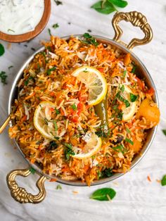 a bowl filled with rice and lemon slices