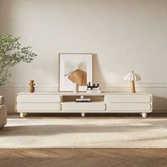 a living room scene with focus on the coffee table and plant in the centerpiece