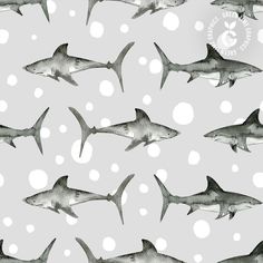 a gray and white pattern with sharks on it