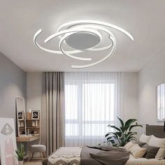 a bedroom with a bed and a ceiling light