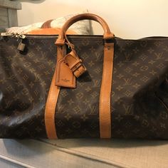 Louis Vuitton Malletier Carryall Luggage Duffel Bag. In Good Condition Considering It Is Over 30 Years Old. Very Clean. The Zipper Area Is Pulling Apart Slightly, That Is Where The Most Wear Is. Gold Hardware See Pictures. Designer Brown Coated Canvas Travel Bag, Brown Designer Coated Canvas Travel Bag, Luxury Brown Coated Canvas Luggage, Luxury Brown Luggage With Dust Bag Included, Business Brown Monogram Canvas Luggage, Designer Brown Luggage, Designer Brown Luggage With Leather Handles, Brown Leather Trim Bag For Everyday Luxury, Designer Brown Luggage With Leather Trim